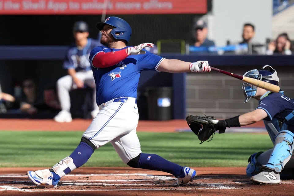 Blue Jays beat Rays 13-4 to win East title and earn bye to division series