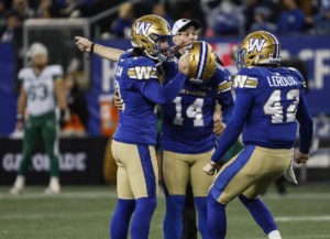 Bombers win ugly to keep playoff hopes alive