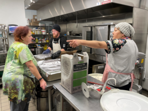 Carmichael Outreach serves special New Year’s Eve meal to hundreds in need