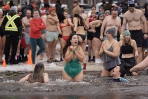 Many mark the new year with 'exhilarating' polar dip in icy water