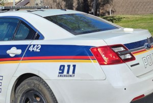 Man charged after stolen SUV flees police, hits parked vehicles