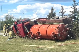 Driver taken to hospital after vac truck rollover in Regina