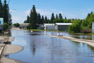 Norquay residents urged to conserve water as flooding swamps streets and basements