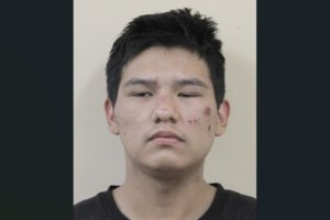 Arrest warrant issued for man facing robbery, weapons charges