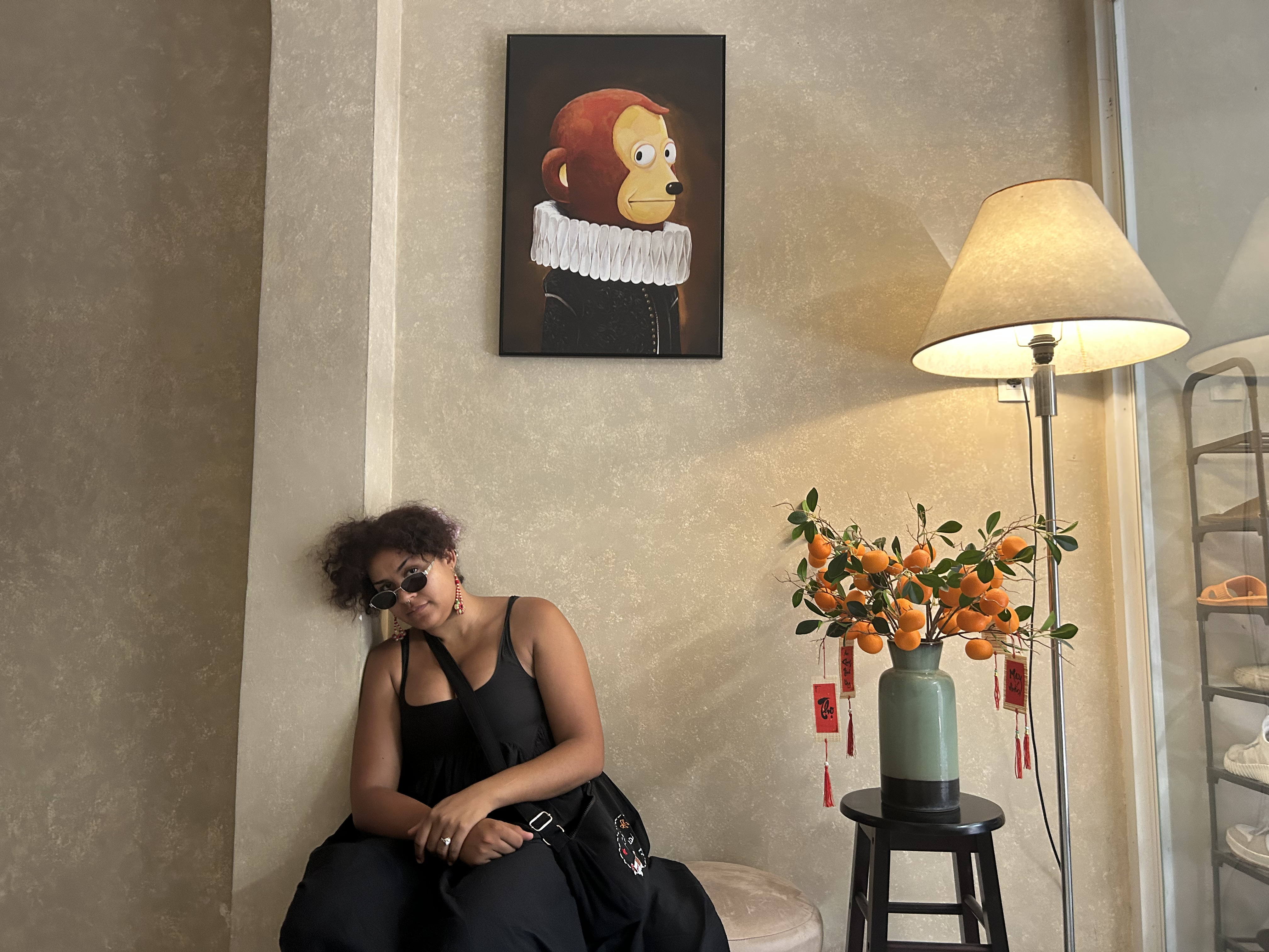 aaliyah tired under a suspicious monkey portrait