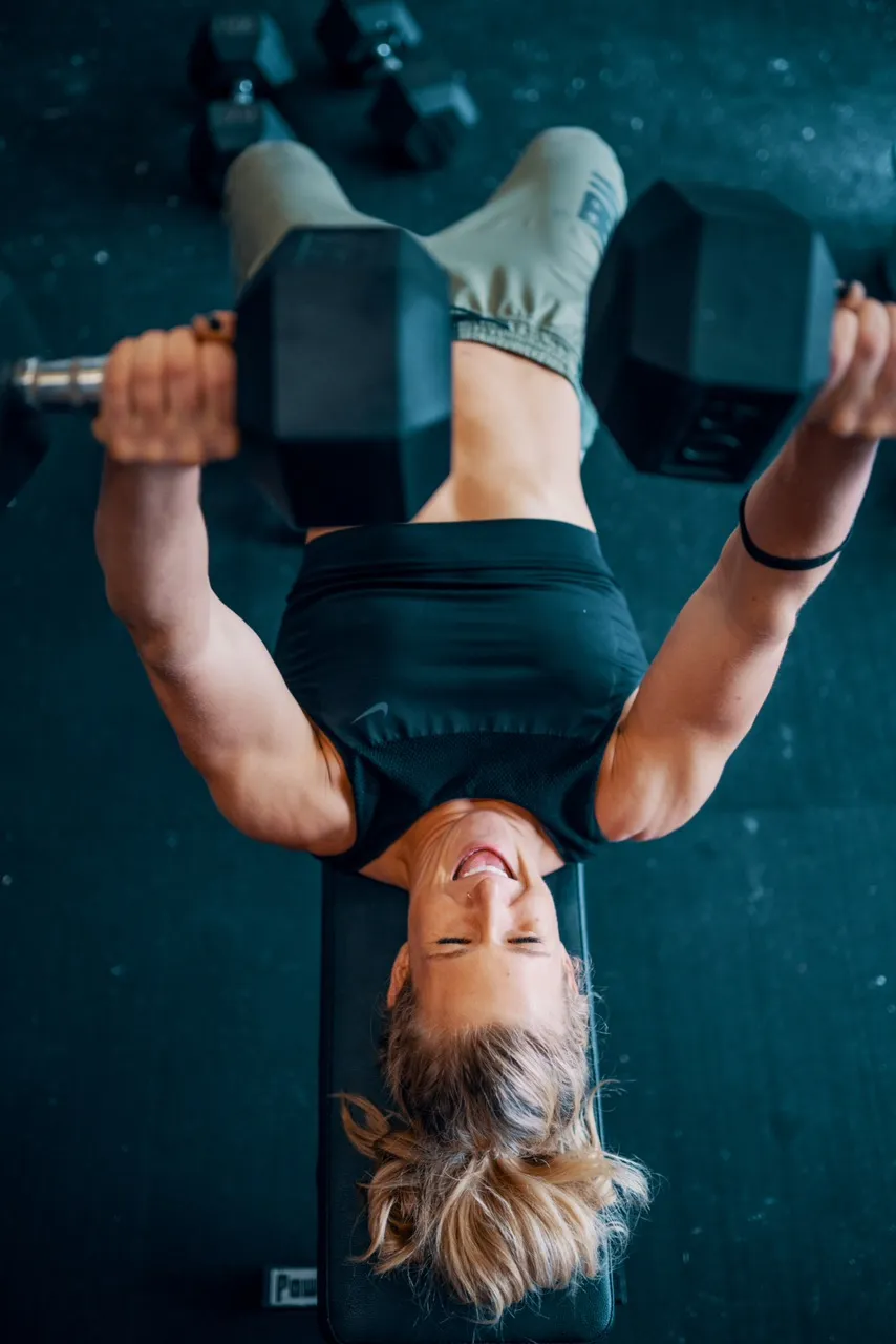Jessica Cahoy Chest Pressing Dumbells