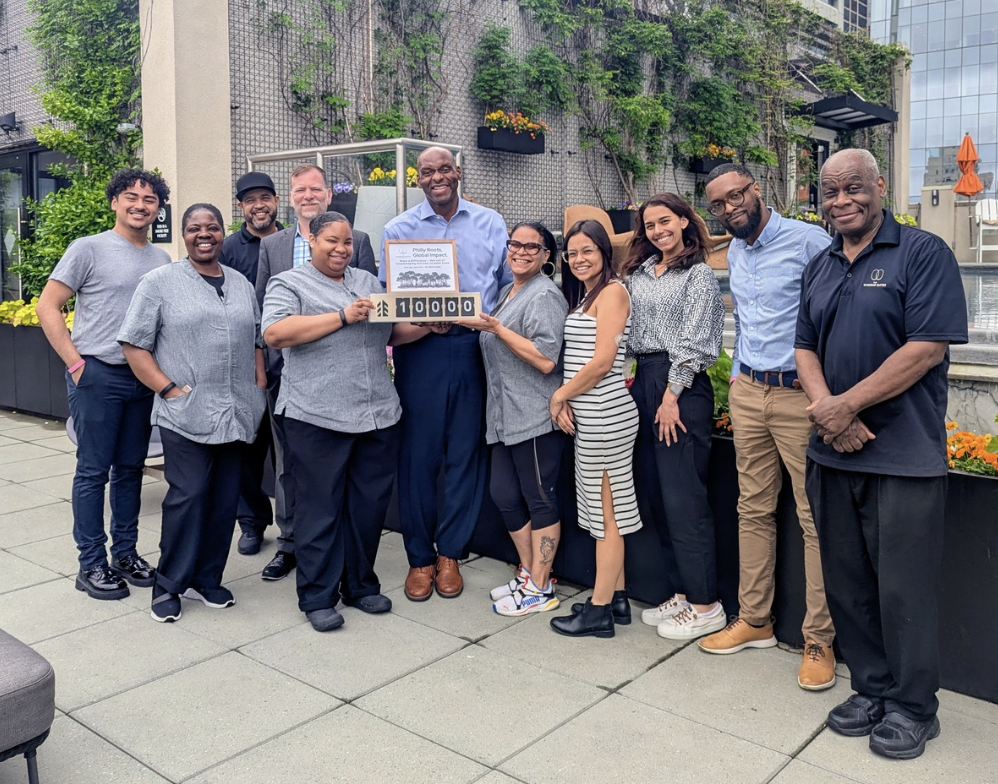 Company team celebrating 10,000 trees planted