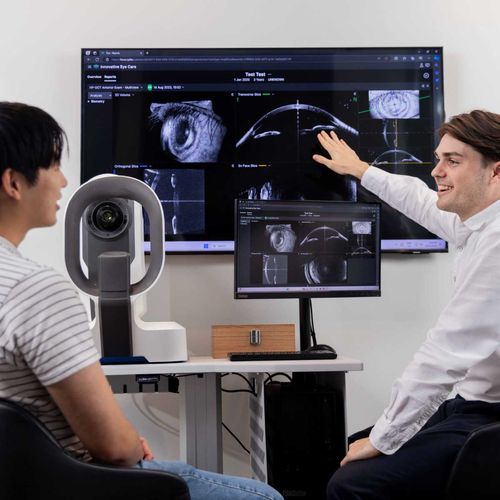 Innovative Eye Care optometrist explaining corneal scan results during keratoconus consultation in Adelaide