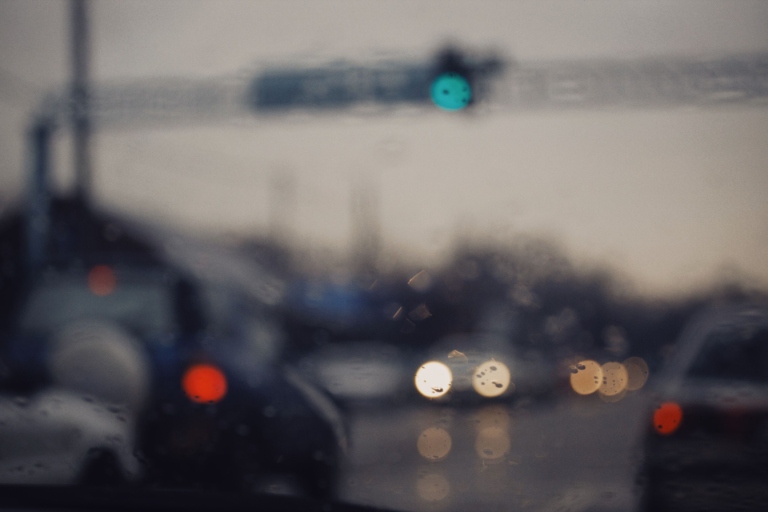 Blurred view of traffic and headlights representing distance vision with myopia
