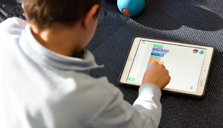 Child using a tablet at close range