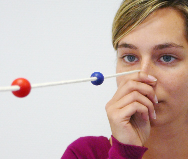 Woman completing a Brock string test to assess eye coordination and binocular vision