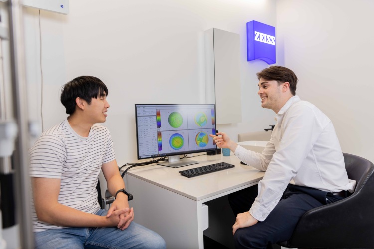 Adult patient discussing eye health and vision with an optometrist
