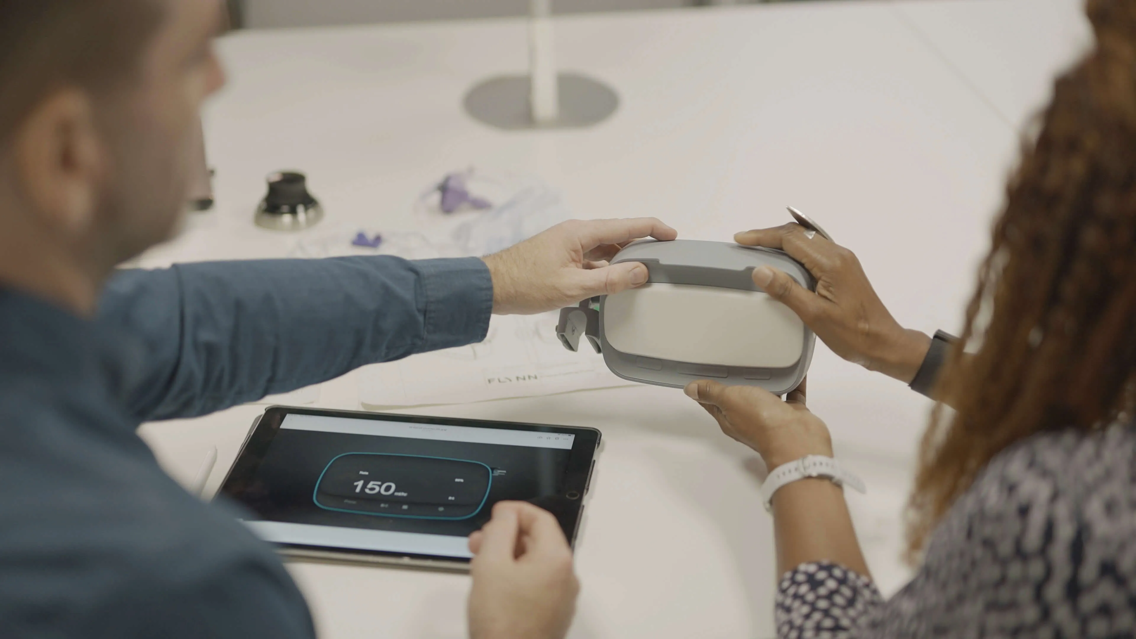 Woman and man looking at a prototype by flynn