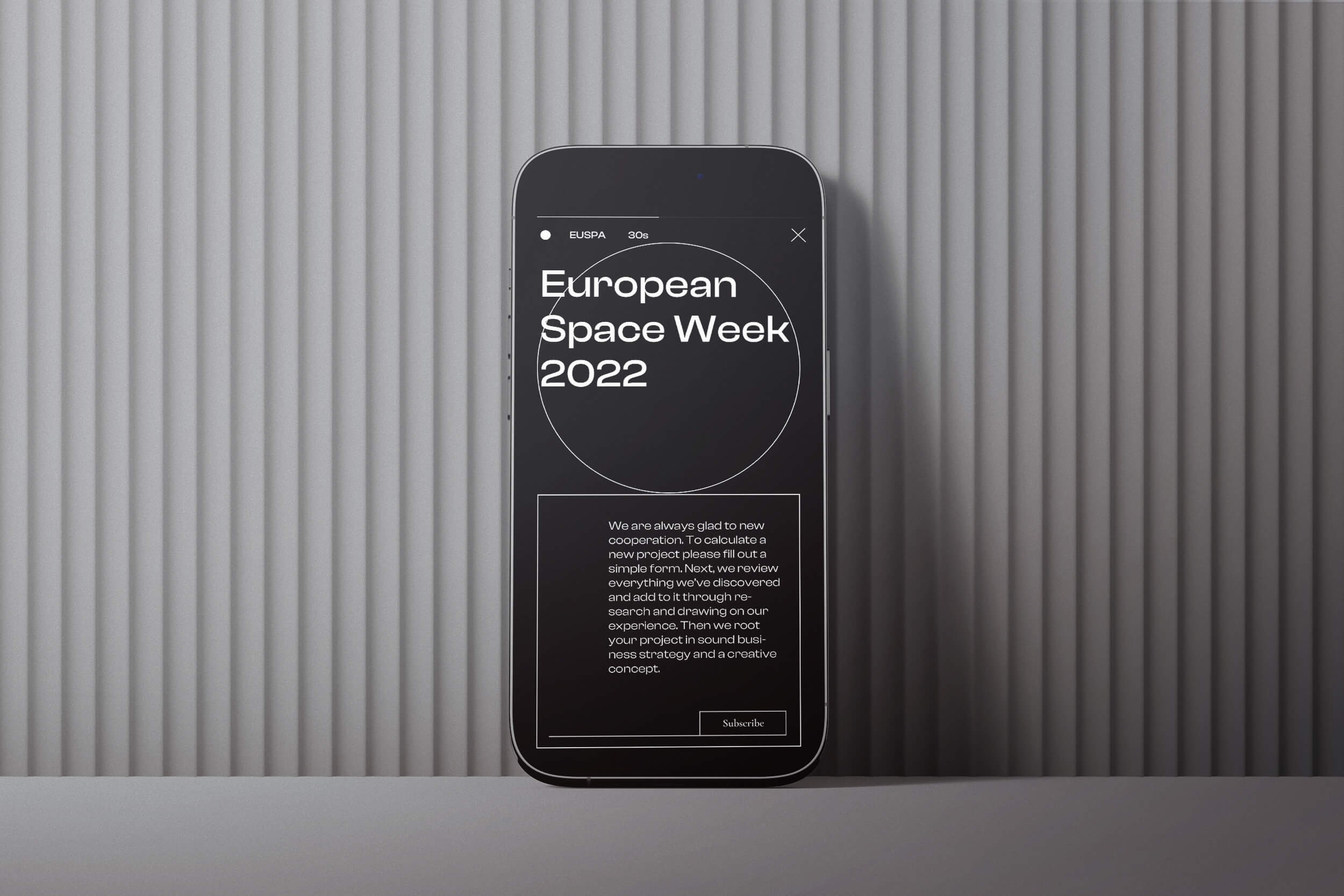 A phone in front of a wall.