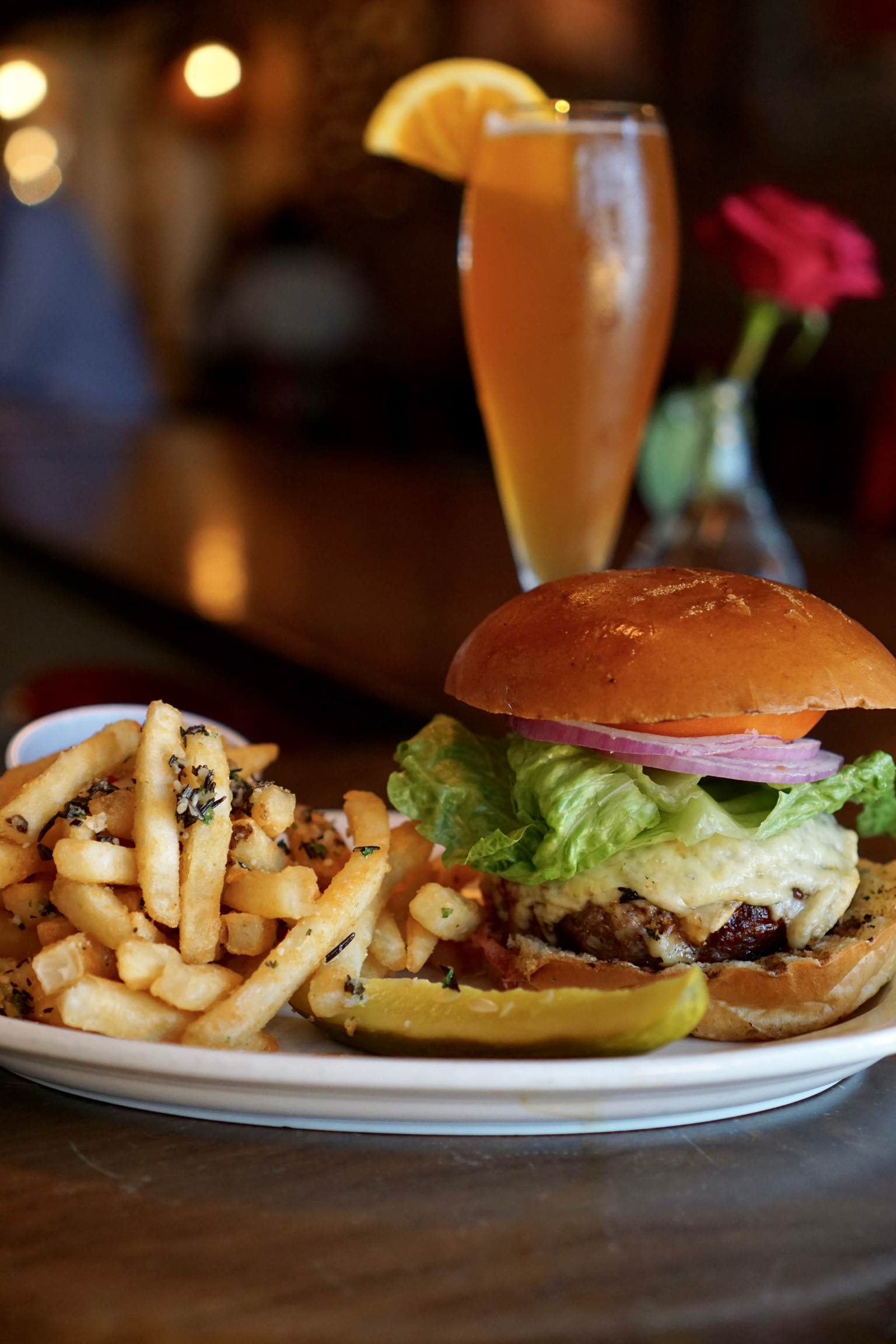 Kurant cheeseburger with lettuce, tomato, and onion served with seasoned fries and draft beer, part of the World Cup game-day special for $26.