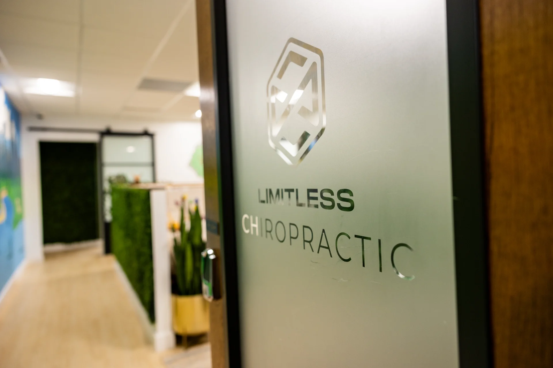 Limitless Chiropractic frosted-glass entrance in Austin