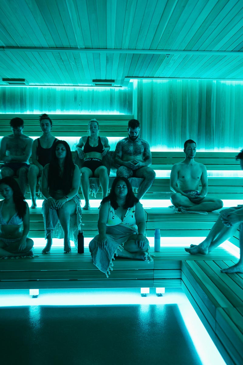 A group sitting together in Tevah's sauna during a guided session
