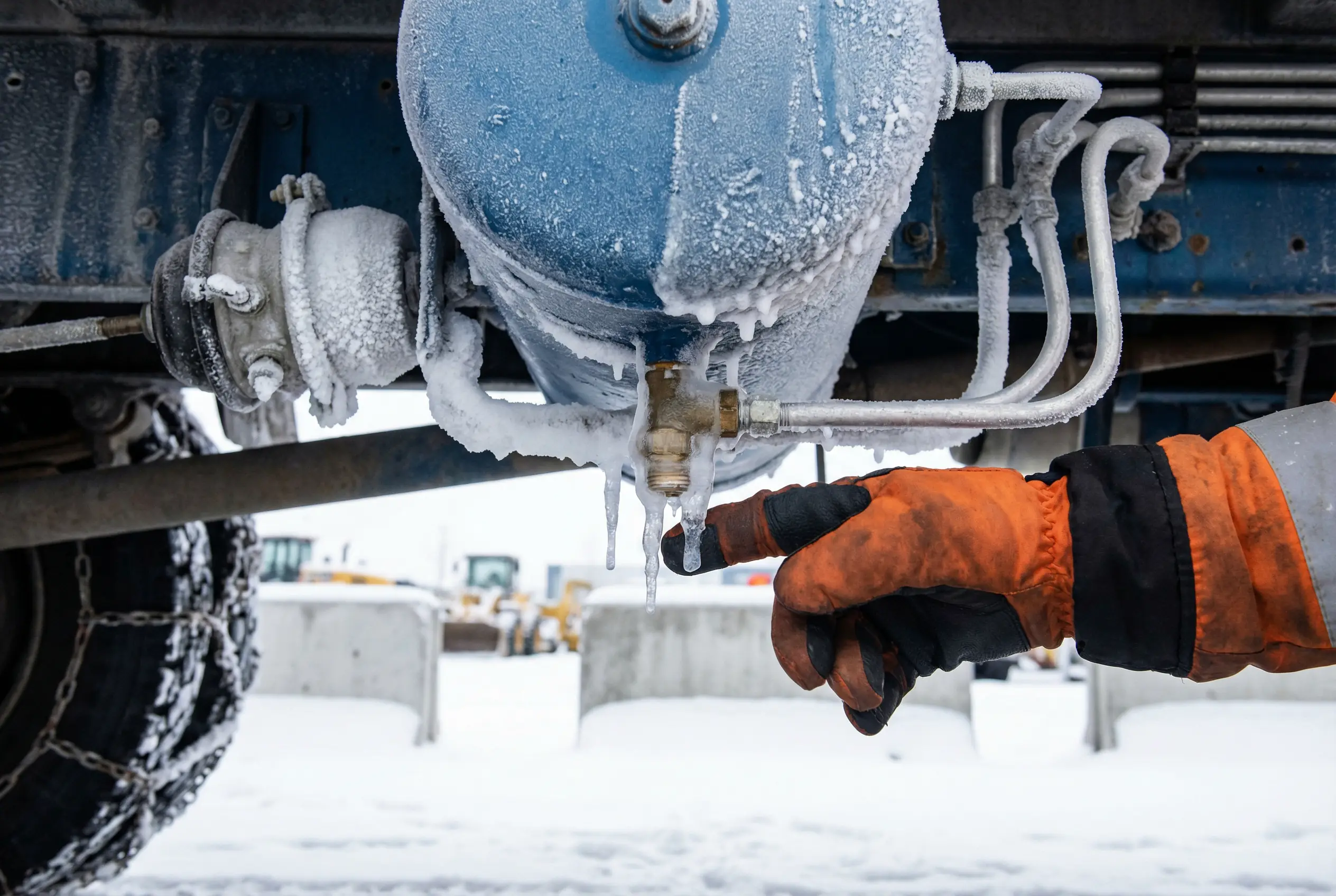Frozen air brake lines ice buildup dump truck winter construction equipment maintenance