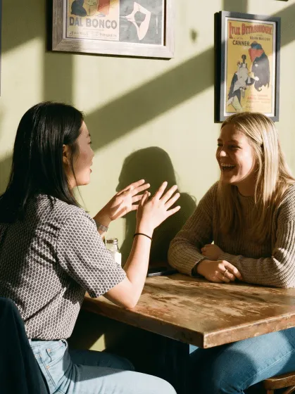 Two women having a conversation in English