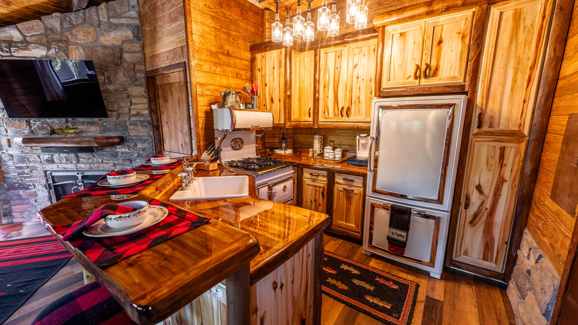 Custom cabin kitchen with log cabinetry