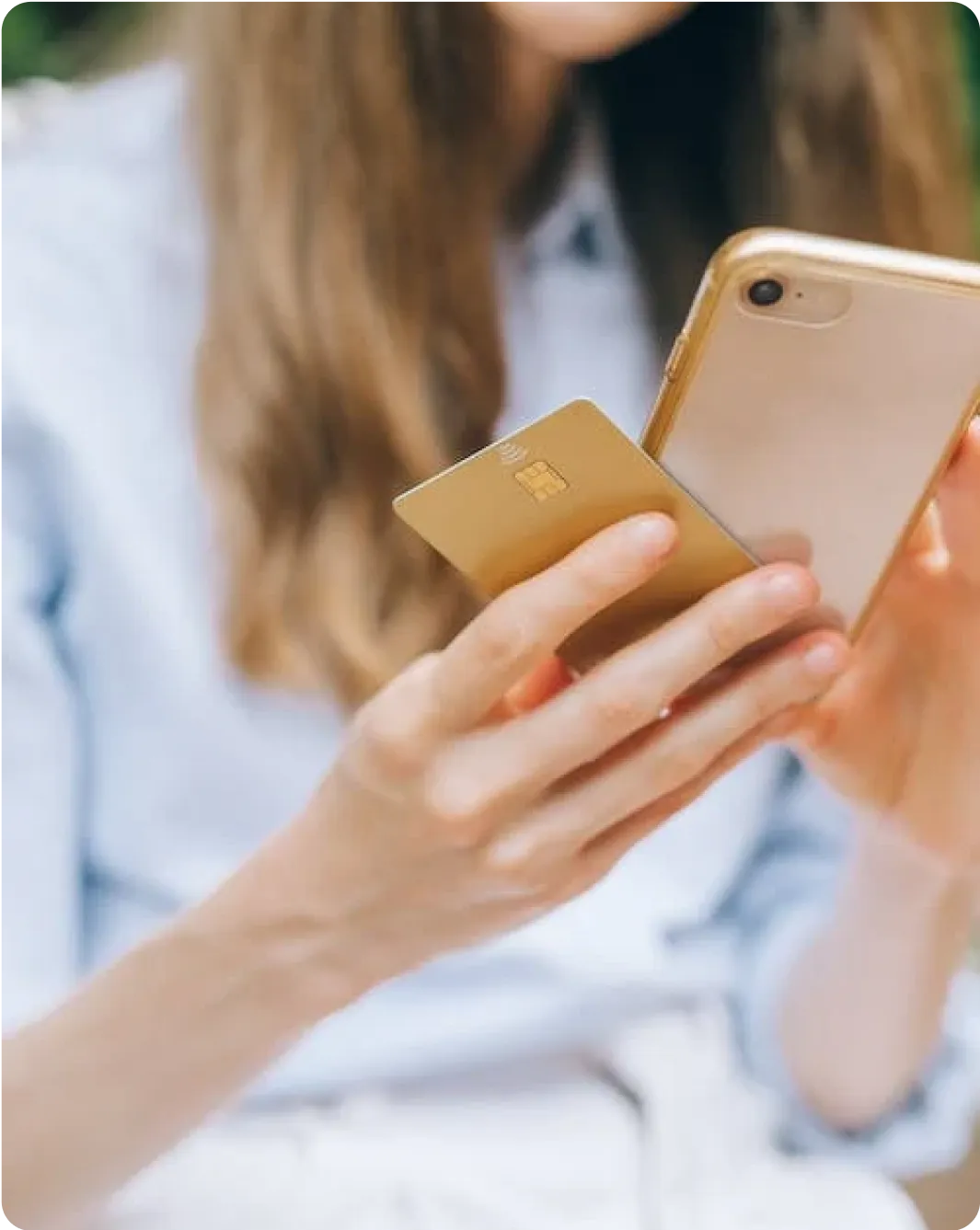 A woman is holding a mobile phone with her finger