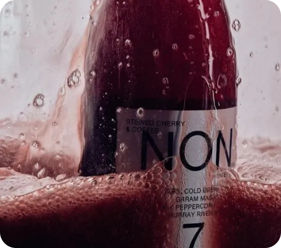 "a bottle of a beverage, likely a non-alcoholic drink or a cocktail. 
"