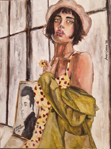 A girl in a flowery dress stands thoughtfully by the window