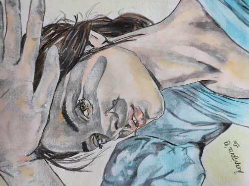 The girl shields her face from the sun