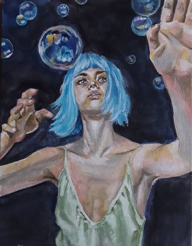 A girl with blue hair tries to catch soap bubbles