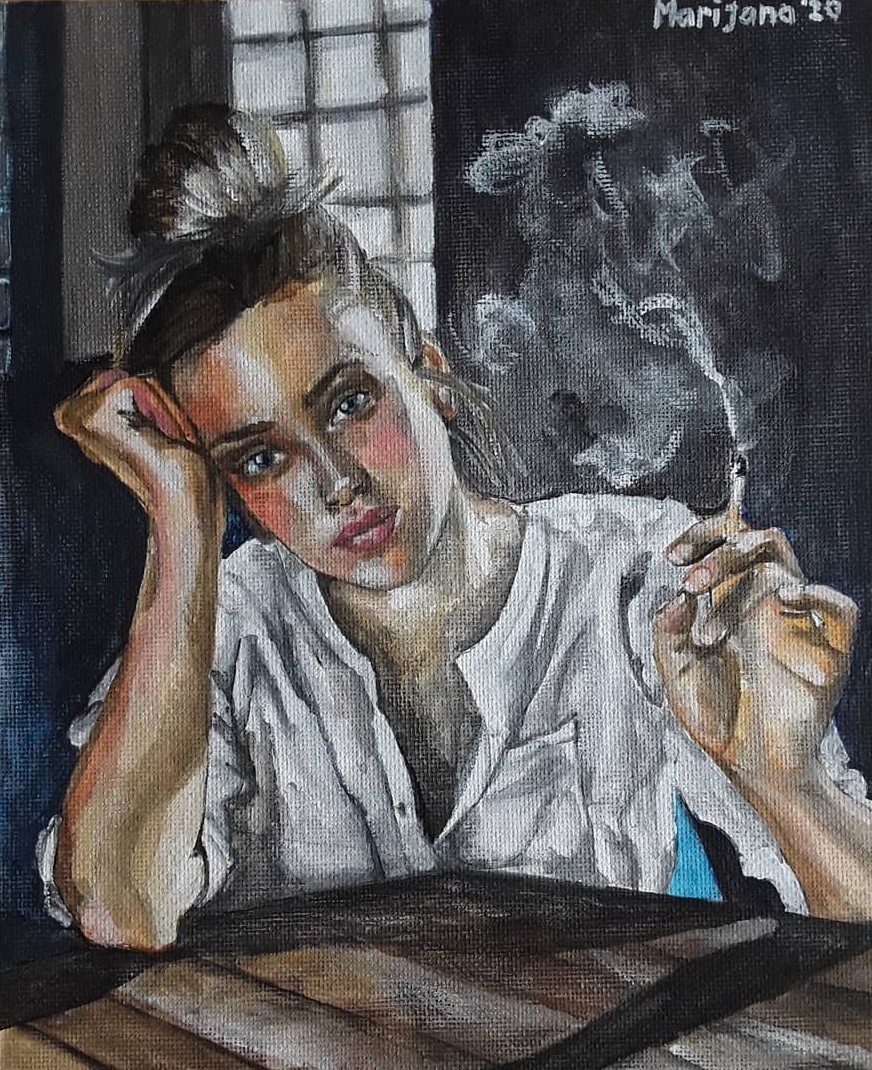 The girl is sitting at the table, smoking and looking at the viewer