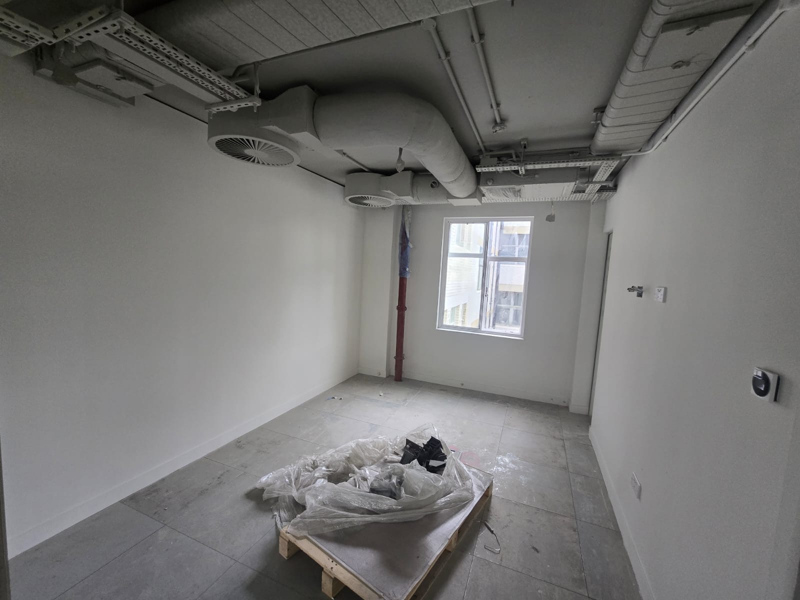 On-site spraying preparation in a commercial fit-out, London