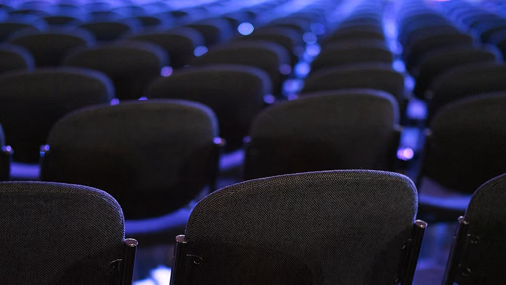 'Insulting and belittling': Legalweek attendees slam AI company's 'woman in red dress' booth