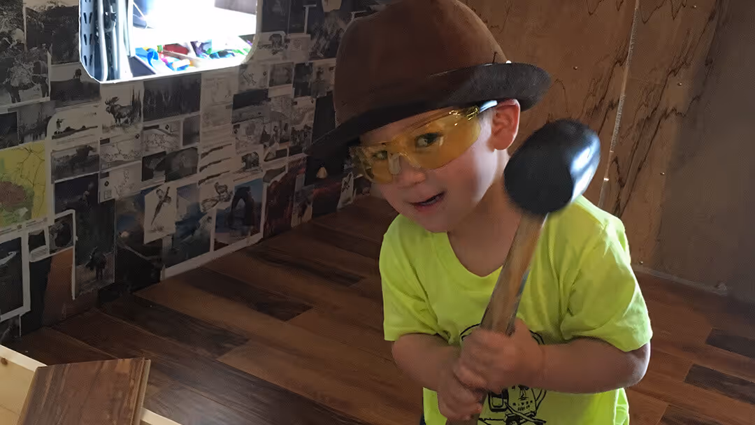 Kid holding the hammer