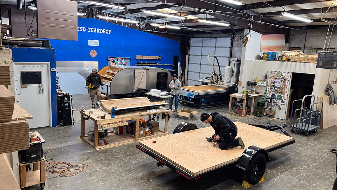 3 guys building the trailer truck