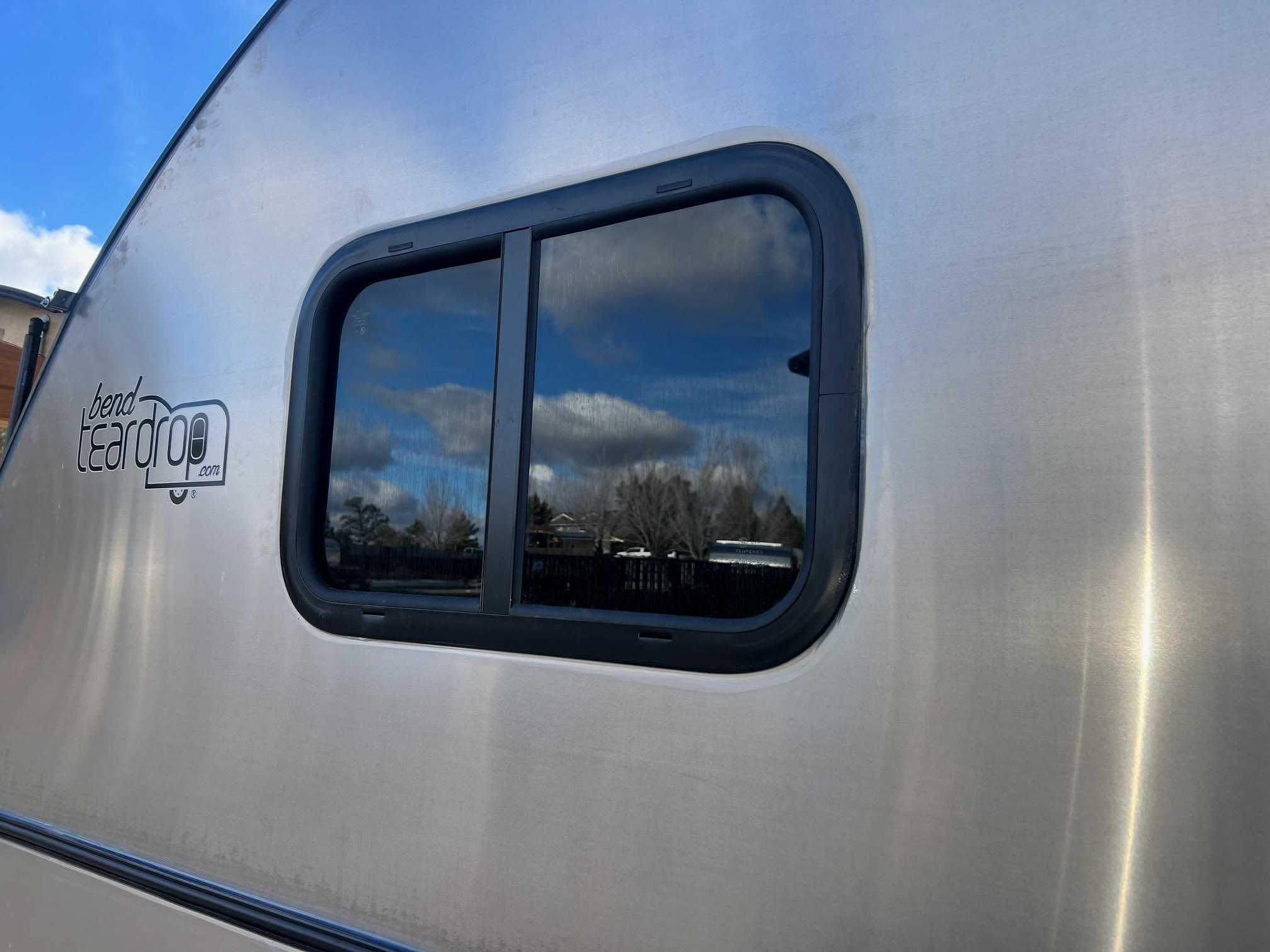 24″x15″ tinted screened slider window driver side.