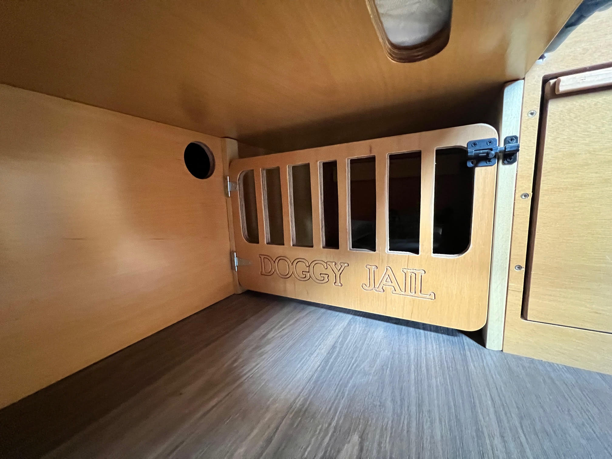 Fenced small pet kennel under the back bed 