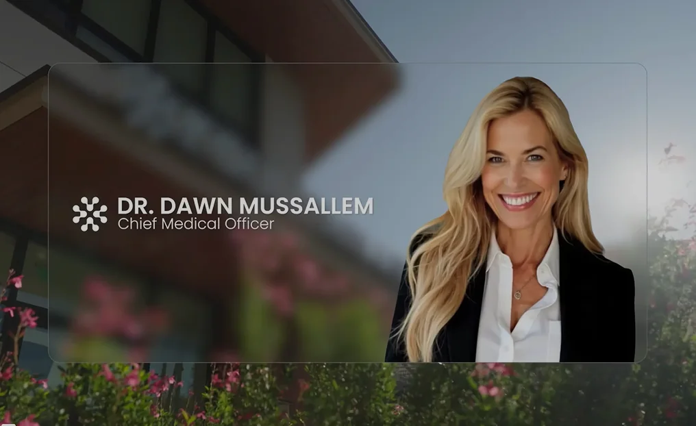 Smiling blonde woman in a black blazer and white shirt identified as Dr. Dawn Mussallem, Chief Medical Officer.