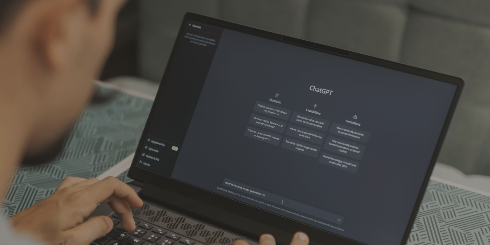 A man enters a search query in ChatGPT on his laptop. 