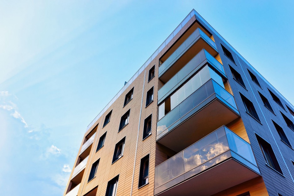 a tall building with balconies on the side