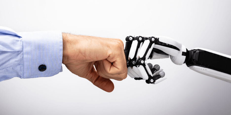 A human fist in a blue shirt connects with a robotic fist, symbolizing human-robot collaboration. The mood is cooperative and futuristic.