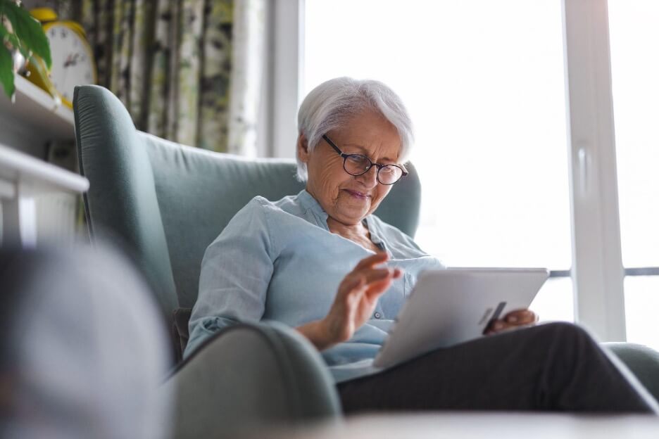 Elderly woman using a tablet