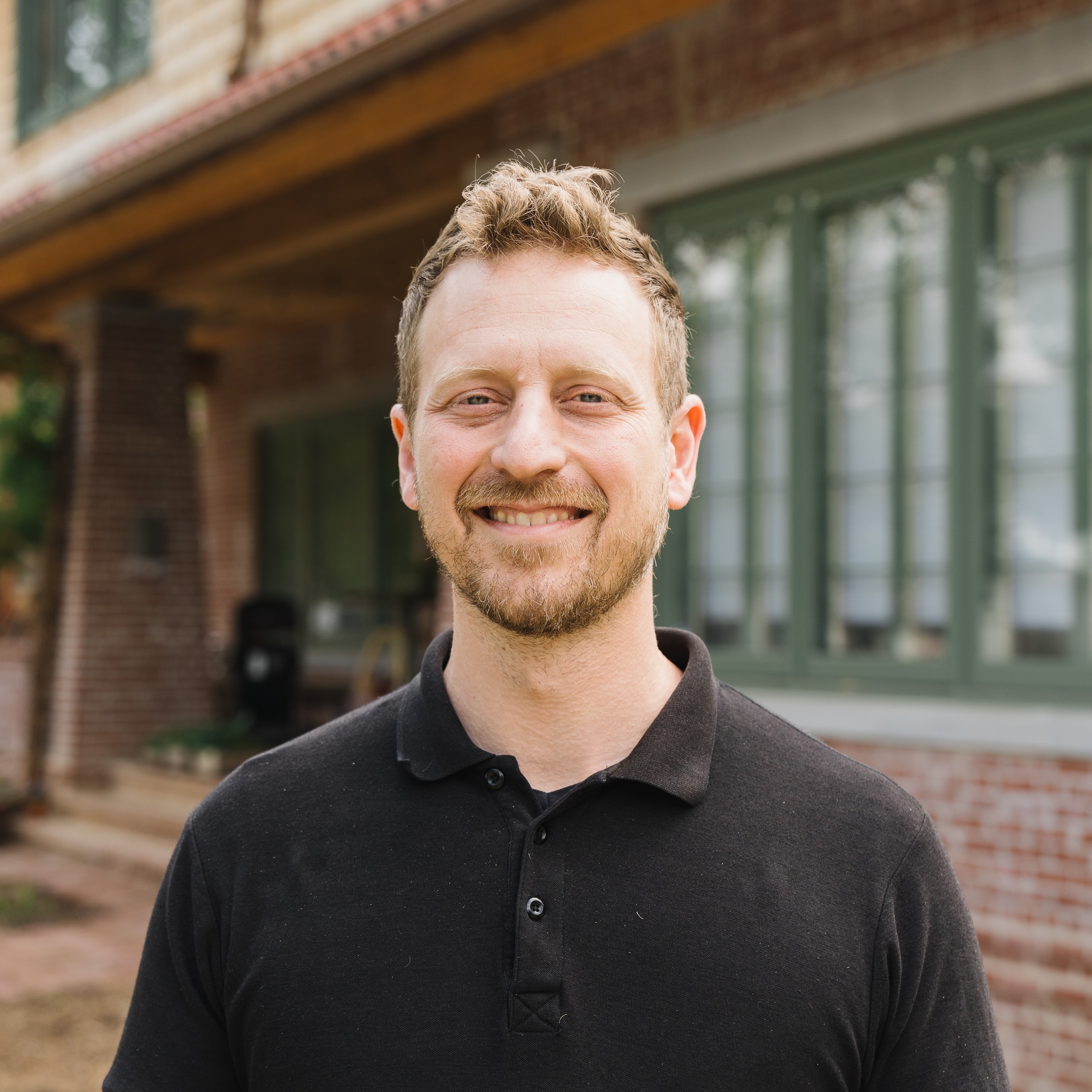 Photo of three 9b team members smiling during a meeting