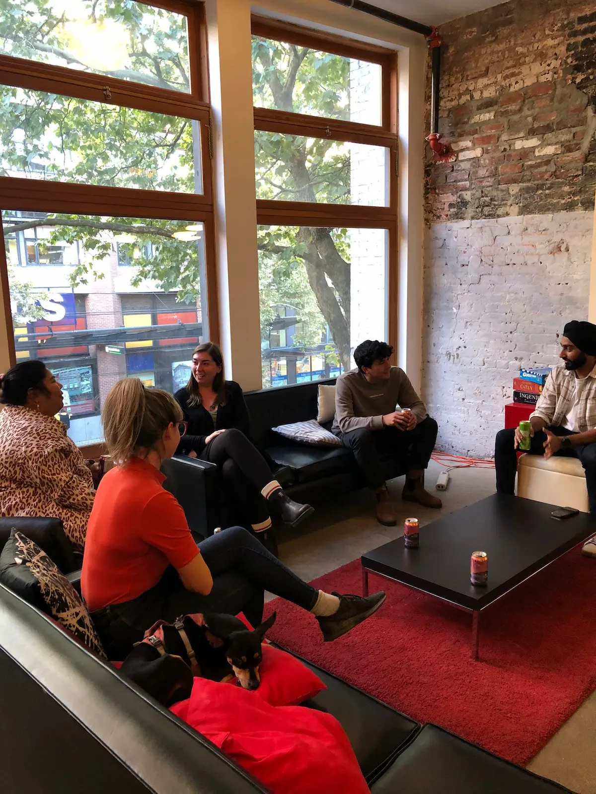 Coworkers speaking to each other in the Hive coworking space