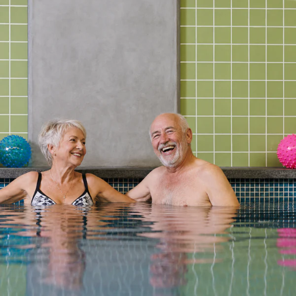 Older couple enjoying their time in the swimming pool at Mayflower Brighton retirement village.