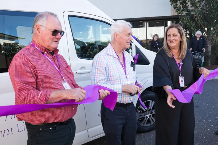 Ribbon Cutting ceremony for the new minibus at Mayflower brighton with two volunteer bus drivers and the head fundraising, Nicole. 