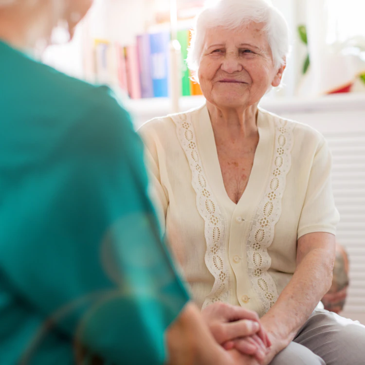 Woman smiling at nurse