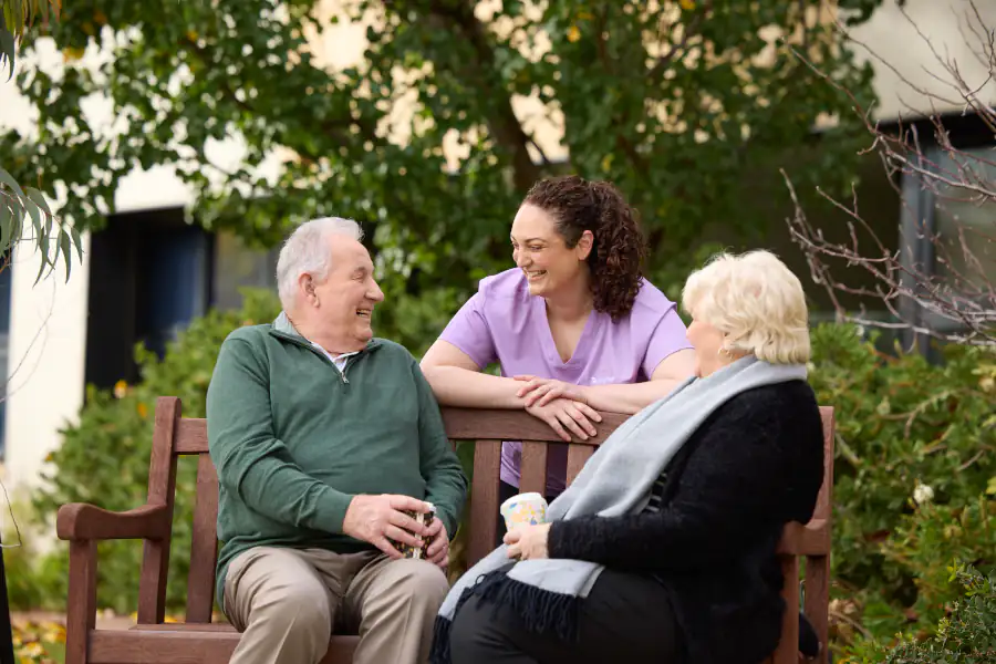 Mayflower Edith Bendall resident and staff member enjoying an afternoon event.