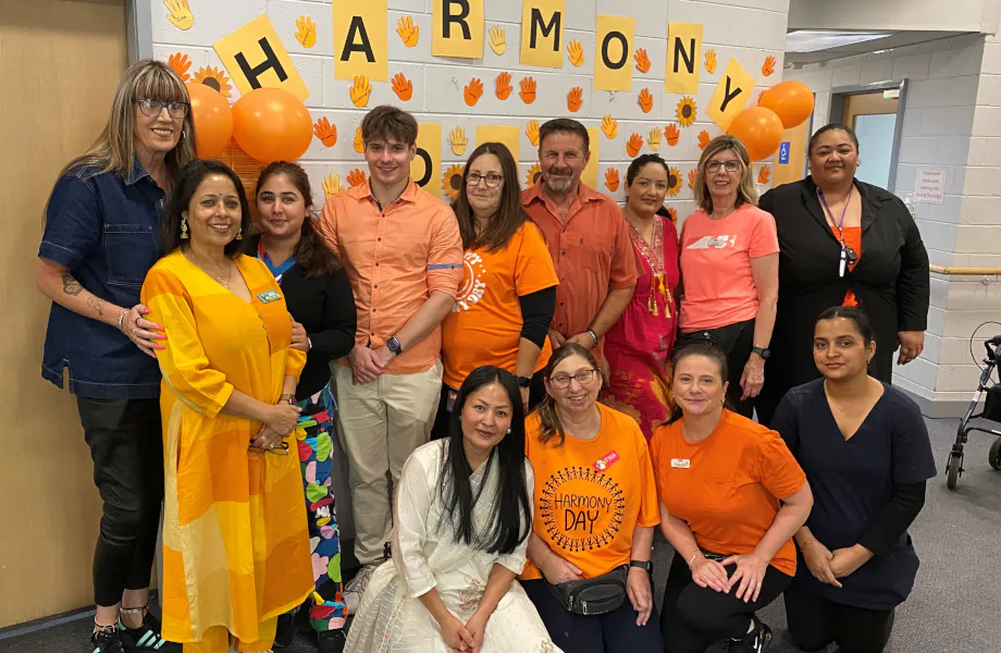 The Mayflower Edith Bendall team on Harmony day 2026 wearing orange and traditional dress.