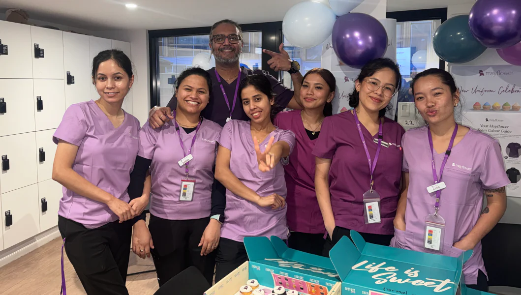 Staff at Mayflower celebrate new uniforms with cupcakes.