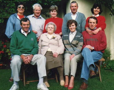 A large family photo, of Nina, her mum, and her siblings. All are adults.